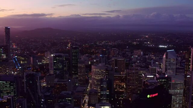 Beautiful Buildings At Brisbane Central Business District At Night In Queensland, Australia. - aerial drone shot