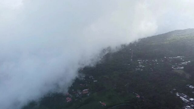 Clouds Above The Green Mountains In El Salvador - View From Boqueron Volcano In The City Of San Salvador - aerial drone