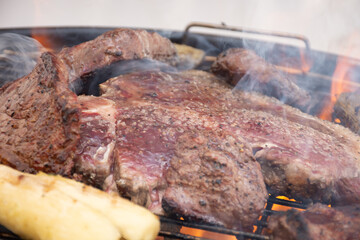 barbecue meats (t-bone and picanha) on the grill