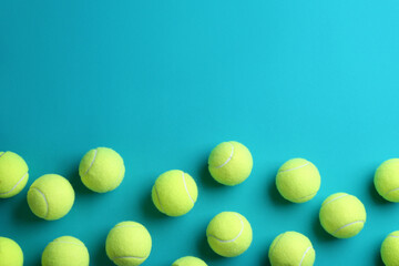Tennis balls on blue background, flat lay. Space for text