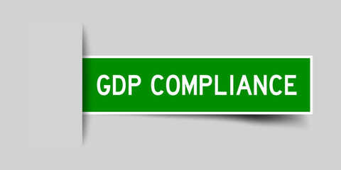 Inserted green color sticker label with word GDP (Abbreviation good distribution practice) Compliance on gray background