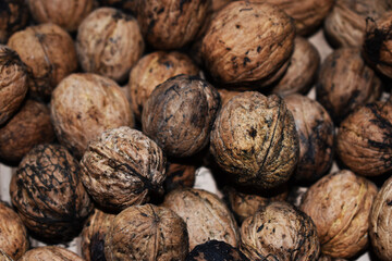 Walnuts background, natural brown color


