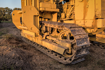 Fototapeta na wymiar caterpillar of a yellow bulldozer