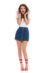 Surprised Young Woman In Red High Heels Is Shouting And Gesturing