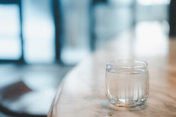 Clean water in small glass. Healthy concept