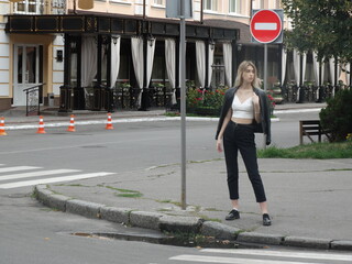 person with a traffic sign in the street