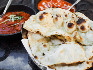 Naan or nan, popular bread in India made from oven baked flatbread or white flour. Serve with curry or dip with indian sauce.