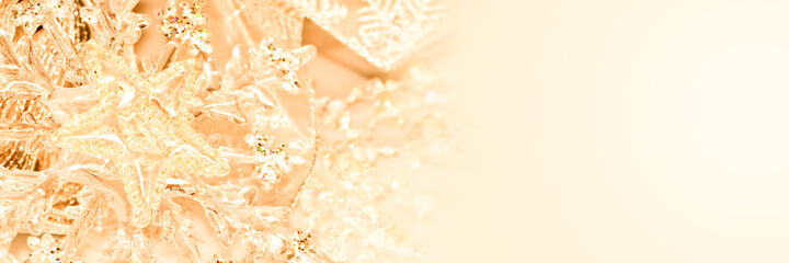 Golden shiny Christmas ornaments on panoramic background, holiday web banner