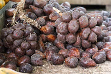 zalacca fruit that is still with its stalk, with skin like snake scales, selective focus