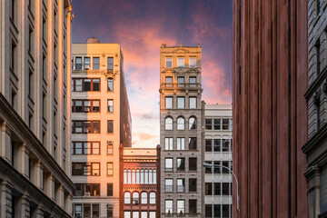 Colorful sunset sky above the historic buildings along Broadway in New York City