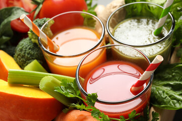 Delicious vegetable juices and fresh ingredients, closeup view