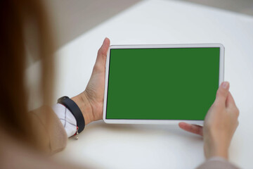 Green Screen and Chroma Key of Tablet Computer. Business Man Holding Mobile PC and Working Closeup....