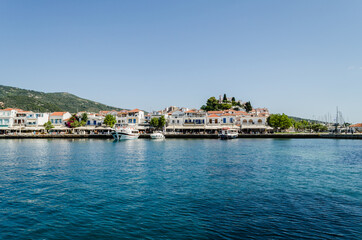 Naklejka na ściany i meble Evia island, Greece - June 28. 2020: Panorama of the tourist island of Skiathos in Greece 