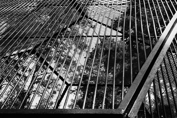metal rods in a cage against the background of the sky