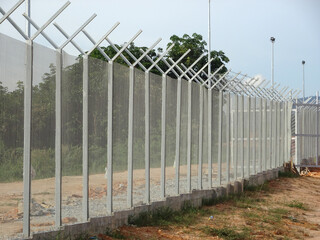 MELAKA, MALAYSIA -JUNE 5, 2020: Anti-climb fencing made from galvanized iron install at the...