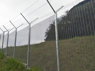 MELAKA, MALAYSIA -JUNE 5, 2020: Anti-climb fencing made from galvanized iron install at the...