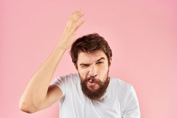 Bearded man white t-shirt cropped view lifestyle studio pink background