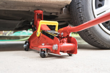 Fototapeta premium Car floor jack for car for repair check Maintenance of cars