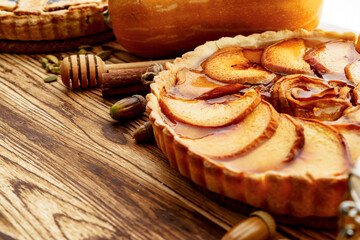 Close up of an apple tart pie on wooden table
