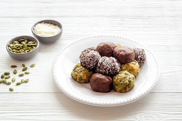 Homemade raw chocolate balls - vegan truffles with cacao and coconut