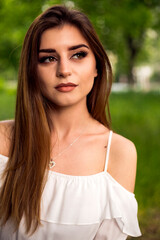 Naklejka premium woman portrait outdoor in the green park
