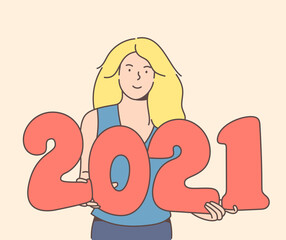 Smiley blonde woman holding 2021 balloons. Christmas holiday celebration, winter season tradition.