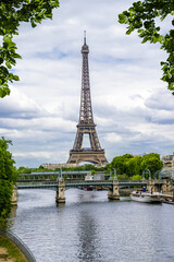 Fototapeta na wymiar Eiffel tower on the background of the river Seine surrounded by leaves. Paris. France.