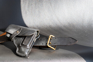 Black leather holster and leather belt.