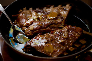 Close up of pork ribs on pan