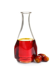 Palm oil in glass bottle and fruits isolated on white