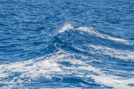 Waves of blue-white foamy sea water © caocao191