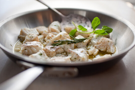 Close up of olive oil poached halibut nuggets