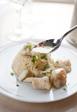 Close up of olive oil poached halibut nuggets