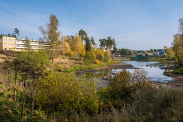 Fototapeta na wymiar Autumn landscape with a dried-up pond in the city of Kokhma, Ivanovo region.