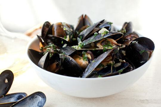 Close up of steamed mussels with garlic and mustard