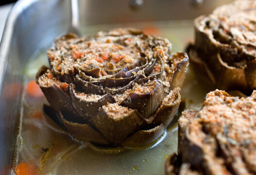 Stuffed artichokes with lemon zest, rosemary and garlic