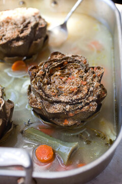 Stuffed artichokes with lemon zest, rosemary and garlic