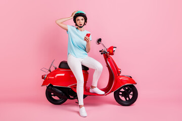 Obraz na płótnie Canvas Photo of astonished pretty woman stuck traffic read bad news telephone dress trousers sneakers slam t-shirt isolated on pink background