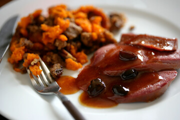 Gourmet meal on plate with sliced beets with sauce