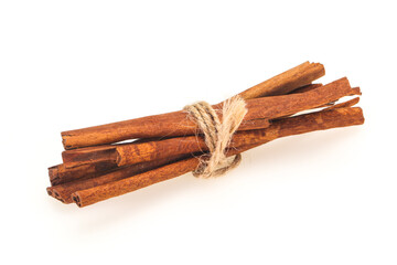 Cinnamon sticks heap isolated on white