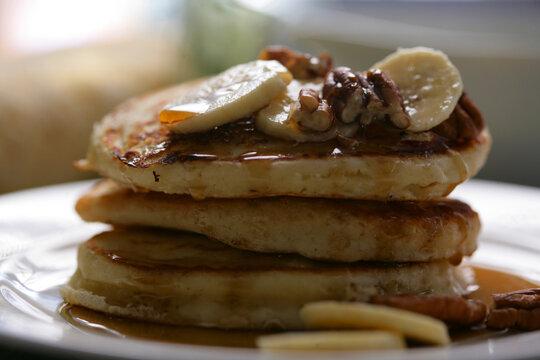 Close up of pancakes with fruits and syrup