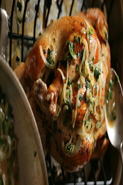 Whole roasted chicken with onion and herbs