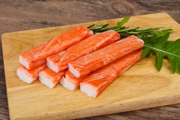 Crab stick surimi over board