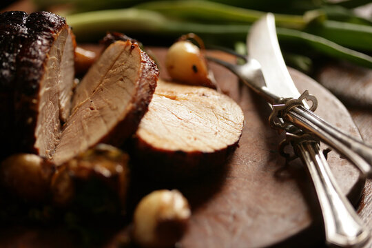 Close up of meat roast on cutting board