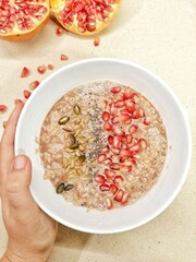 Fototapeta na wymiar bowl of oatmeal with raisins