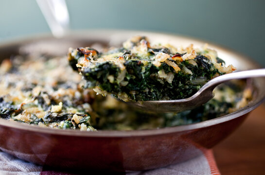 Close up of baked dish with swiss chard and spinach