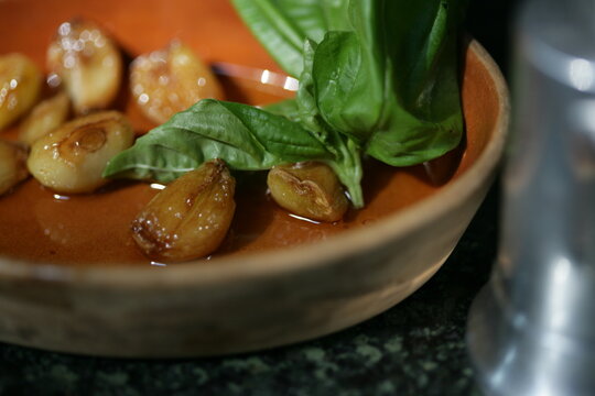 Close up of tomato, garlic and basil soup