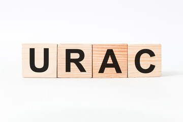 word URAC on wooden blocks, white background, business concept. business and Finance