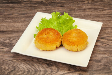 Vegan cuisine - Potato cutlet in the plate