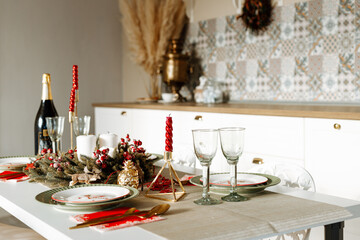 Beautiful table setting with Christmas decorations in living room